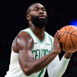 Caption: Nov 3, 2025; Boston, Massachusetts, USA; Boston Celtics guard Jaylen Brown (7) shoots a free throw during the first half against the Utah Jazz at TD Garden.