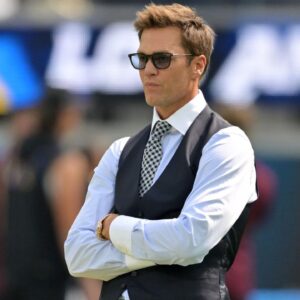 Tom Brady looks on before the game between the Los Angeles Chargers and the Washington Commanders at SoFi Stadium.
