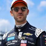 Jun 21, 2025; Long Pond, Pennsylvania, USA; NASCAR Cup Series driver Daniel Suarez walks on pit road during practice and qualifying for The Great American Getaway 400 at Pocono Raceway