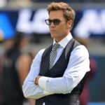 Tom Brady looks on before the game between the Los Angeles Chargers and the Washington Commanders at SoFi Stadium.