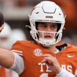 Texas Longhorns quarterback Arch Manning (16) warms up before a game against the Vanderbilt Commodores at Darrell K Royal-Texas Memorial Stadium.