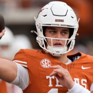 Texas Longhorns quarterback Arch Manning (16) warms up before a game against the Vanderbilt Commodores at Darrell K Royal-Texas Memorial Stadium.