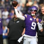 Minnesota Vikings quarterback J.J. McCarthy (9) throws a pass during warm ups before the game against the Philadelphia Eagles at U.S. Bank Stadium.