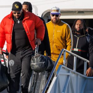 Kansas City Chiefs tight end Travis Kelce (87) exits the plane after arriving at Louis Armstrong New Orleans International Airport.