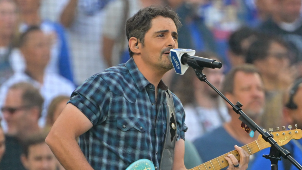Oct 27, 2025; Los Angeles, California, USA; American singer Brad Paisley performs the United States national anthem before game three of the 2025 MLB World Series between the Toronto Blue Jays and the Los Angeles Dodgers at Dodger Stadium. Mandatory Credit: Jayne Kamin-Oncea-Imagn Images