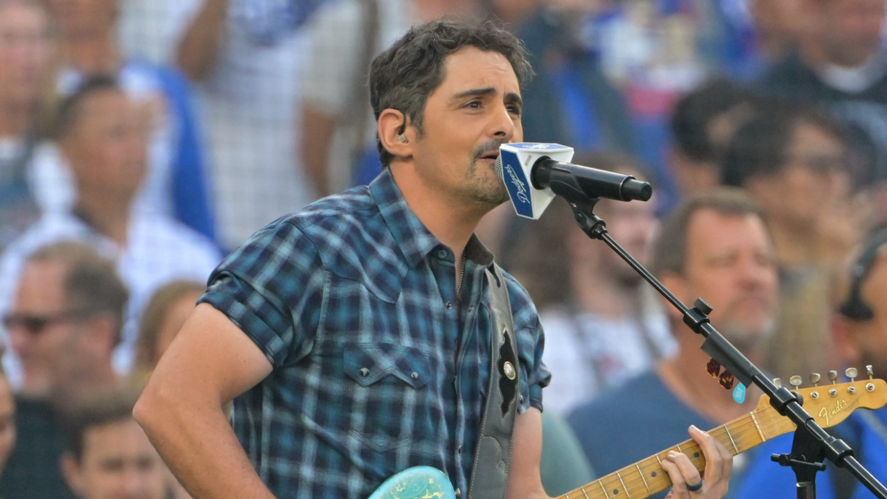 Oct 27, 2025; Los Angeles, California, USA; American singer Brad Paisley performs the United States national anthem before game three of the 2025 MLB World Series between the Toronto Blue Jays and the Los Angeles Dodgers at Dodger Stadium. Mandatory Credit: Jayne Kamin-Oncea-Imagn Images