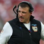 New England Patriots head coach Mike Vrabel walks downfield during the third quarter against the Tampa Bay Buccaneers at Raymond James Stadium.