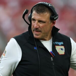 New England Patriots head coach Mike Vrabel walks downfield during the third quarter against the Tampa Bay Buccaneers at Raymond James Stadium.