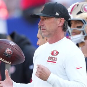San Francisco 49ers head coach Kyle Shanahan tosses a football in the air during warm ups prior to a game against the New York Giants at MetLife Stadium.