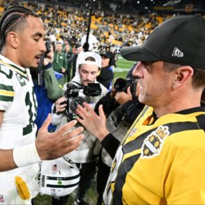 Pittsburgh Steelers quarterback Aaron Rodgers (8) and Green Bay Packers quarterback Jordan Love (10) shake hands after the game at Acrisure Stadium.