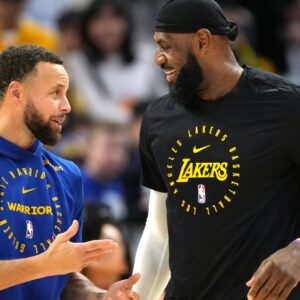 Dec 25, 2024; San Francisco, California, USA; Golden State Warriors guard Stephen Curry (left) and Los Angeles Lakers forward LeBron James (right) talk before the game at Chase Center