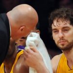 Feb. 3, 2011; Los Angeles, CA, USA; Los Angeles Lakers power forward Pau Gasol (16) sits on the bench as trainer Gary Vitti attends to him after getting an elbow in the eye during the 4th quarter of the game at the Staples Center