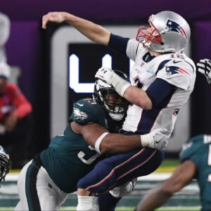 Philadelphia Eagles defensive end Brandon Graham (55) sacks New England Patriots quarterback Tom Brady (12) to fumble the ball in the fourth quarter in Super Bowl LII at U.S. Bank Stadium.