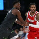 Apr 10, 2025; Memphis, Tennessee, USA; Minnesota Timberwolves guard Anthony Edwards (5) and Memphis Grizzlies guard Ja Morant (12) battle for position during the third quarter at FedExForum