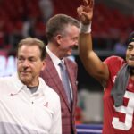 Alabama Crimson Tide head coach Nick Saban, left, and quarterback Bryce Young (9) celebrate their win against the Georgia Bulldogs during the SEC championship game at Mercedes-Benz Stadium. mouth guard