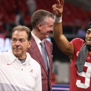Alabama Crimson Tide head coach Nick Saban, left, and quarterback Bryce Young (9) celebrate their win against the Georgia Bulldogs during the SEC championship game at Mercedes-Benz Stadium. mouth guard