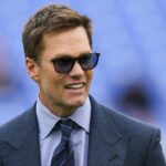 Fox Sports announcer Tom Brady looks on before the game between the Baltimore Ravens and the Los Angeles Rams at M&T Bank Stadium.