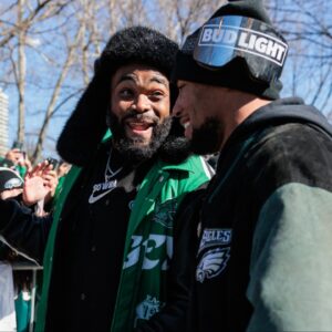 Philadelphia Eagles defensive end Brandon Graham (55) speaks to running back Saquon Barkley (26) during the Super Bowl LIX championship parade and rally.
