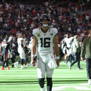 Jacksonville Jaguars quarterback Trevor Lawrence (16) walks off the field after the game against the Houston Texans at NRG Stadium.