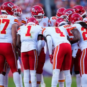 Members of the Kansas City Chiefs offensive squad huddle in the second quarter against the Denver Broncos at Empower Field at Mile High.