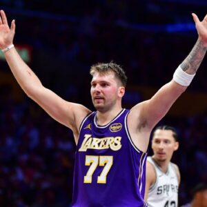 Los Angeles Lakers guard Luka Doncic (77) reacts after scoring a basket against the San Antonio Spurs during the first half at Crypto.com Arena.