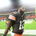 Cleveland Browns quarterback Shedeur Sanders (12) walks off the field following a game against the Baltimore Ravens at Huntington Bank Field.