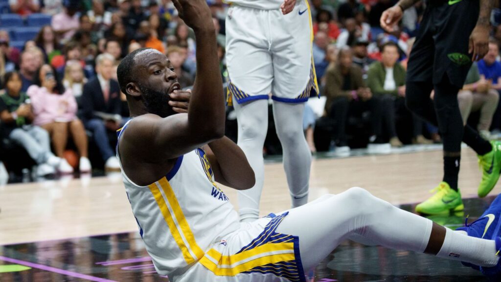 Golden State Warriors forward Draymond Green (23) asks for a review after colliding with New Orleans Pelicans forward Trey Murphy III (25) during the first half at Smoothie King Center