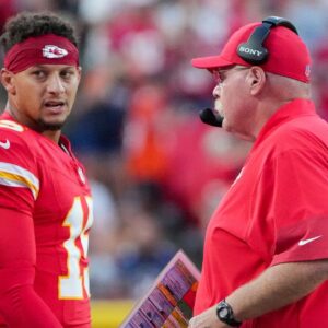 Kansas City Chiefs quarterback Patrick Mahomes (15) talks with head coach Andy Reid after a play against the Chicago Bears during the first half of the game at GEHA Field at Arrowhead Stadium.