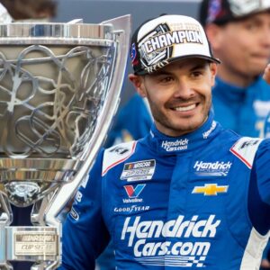Nov 2, 2025; Avondale, Arizona, USA; NASCAR Cup Series driver Kyle Larson (5) celebrates with the Bill France Cup trophy after clinching the 2025 NASCAR Cup Series Championship following the NASCAR Championship race at Phoenix Raceway.