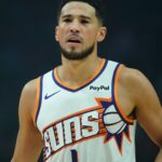 Nov 18, 2025; Portland, Oregon, USA; Phoenix Suns guard Devin Booker (1) looks on during the first half against the Portland Trail Blazers at Moda Center.