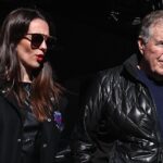 Former New England Patriots head coach Bill Belichick and girlfriend Jordon Hudson enter the field before the game between the Notre Dame Fighting Irish and the Navy Midshipmen at MetLife Stadium.