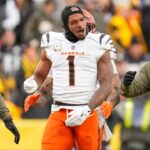 Cincinnati Bengals wide receiver Ja'Marr Chase (1) is pushed out of a skirmish at midfield in the fourth quarter of the NFL Week 11 game between the Pittsburgh Steelers and the Cincinnati Bengals at Acrisure Stadium in Pittsburgh on Sunday, Nov. 16, 2025. The Bengals lost 34-12.
