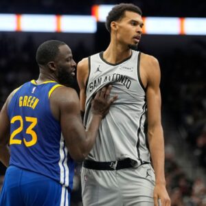 San Antonio Spurs forward Victor Wembanyama (1) waits for an inbound pass while defended by Golden State Warriors forward Draymond Green (23) during the second half at Frost Bank Center.