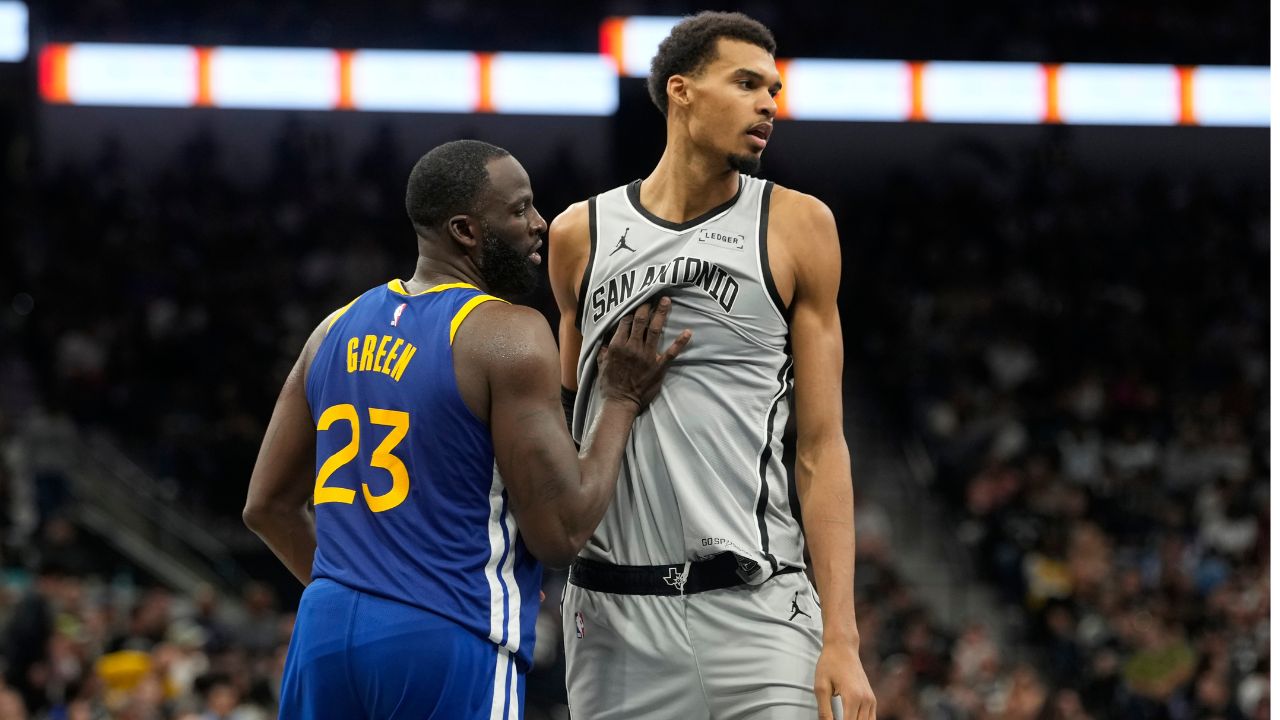San Antonio Spurs forward Victor Wembanyama (1) waits for an inbound pass while defended by Golden State Warriors forward Draymond Green (23) during the second half at Frost Bank Center.