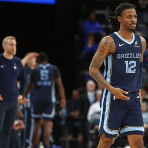 Nov 3, 2025; Memphis, Tennessee, USA; Memphis Grizzlies guard Ja Morant (12) checks into the game during the second quarter against the Detroit Pistons at FedExForum