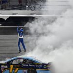 Jul 1, 2017; Daytona Beach, FL, USA; NASCAR Cup Series driver Ricky Stenhouse Jr. (17) celebrates winning the Coke Zero 400 Powered by Coca-Cola at Daytona International Speedway.