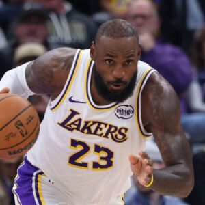 Nov 23, 2025; Salt Lake City, Utah, USA; Los Angeles Lakers forward LeBron James (23) brings the ball up the court against the Utah Jazz during the first half at Delta Center.