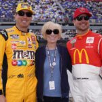 May 8, 2022; Darlington, South Carolina, USA; NASCAR Cup Series driver Kyle Busch (L) poses for a picture with his mother Gaye Busch (C) and brother Kurt Busch (R) on pit road prior to the Goodyear 400 at Darlington Raceway