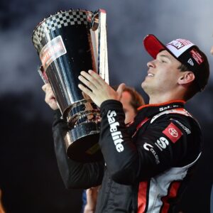 Oct 31, 2025; Avondale, Arizona, USA; NASCAR Gander RV and Outdoors Truck Series driver Corey Heim (11) celebrates his victory following the Truck Series Championship race at Phoenix Raceway.