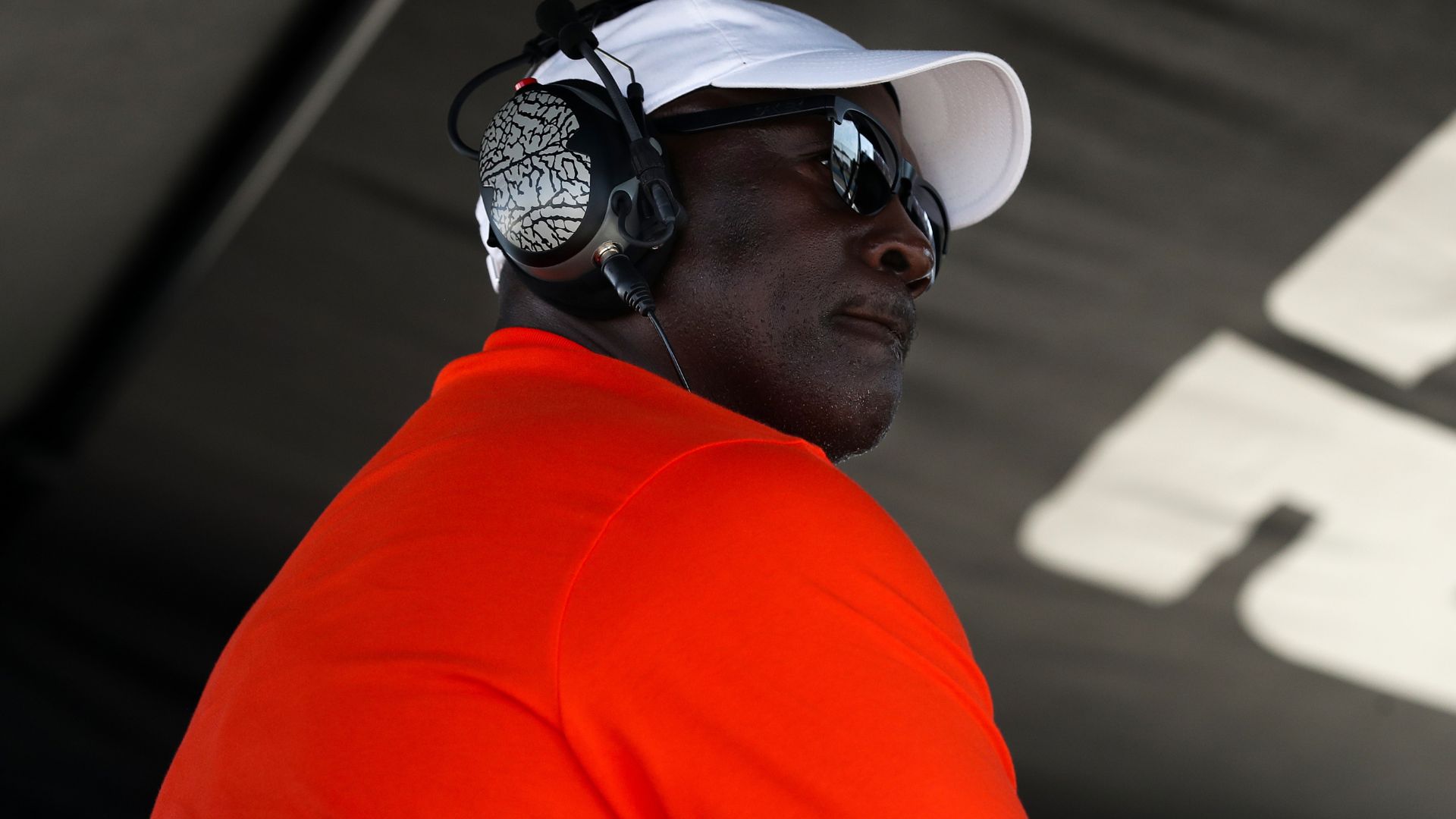 Aug 10, 2025; Watkins Glen, New York, USA; NASCAR Cup Series owner Michael Jordan looks on from atop his team’s pit box during the Go Bowling at The Glen at Watkins Glen International.