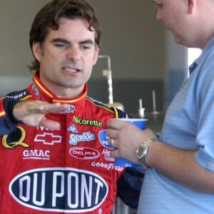Jeff Gordon, left, driver of the No. 24 DuPont Chevrolet, talks to his crew chief Steve Letarte in the garage during NASCAR, Motorsport, USA preseason testing at the Daytona International Speedway in Daytona Beach, Florida