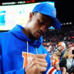 Denver Broncos cornerback Pat Surtain II (2) signs autographs before the game at Empower Field at Mile High.