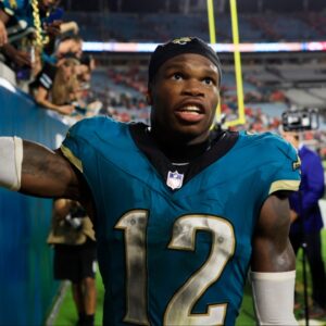 Jacksonville Jaguars wide receiver Travis Hunter (12) high-fives fans after the game of an NFL football matchup at EverBank Stadium, Monday, Oct. 6, 2025, in Jacksonville, Fla. The Jacksonville Jaguars edged the Kansas City Chiefs 31-28. [Corey Perrine/Florida Times-Union]