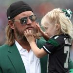 Retired New York Jets center Nick Mangold with his daughter before the game against the Cincinnati Bengals at MetLife Stadium.