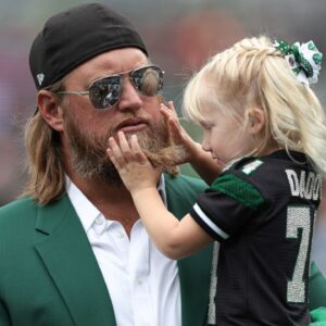 Retired New York Jets center Nick Mangold with his daughter before the game against the Cincinnati Bengals at MetLife Stadium.