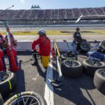 Oct 19, 2025; Talladega, Alabama, USA; Pit crews wait for their drivers during stage two of the YellaWood 500 at Talladega Superspeedway