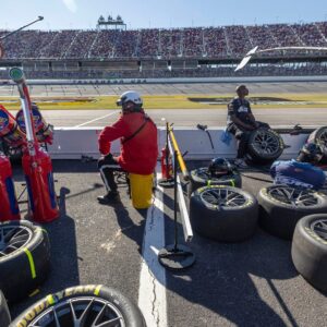 Oct 19, 2025; Talladega, Alabama, USA; Pit crews wait for their drivers during stage two of the YellaWood 500 at Talladega Superspeedway
