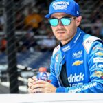 NASCAR Cup Series driver Kyle Larson (5) rides in a truck Sunday, July 27, 2025, ahead of the Brickyard 400 at Indianapolis Motor Speedway.