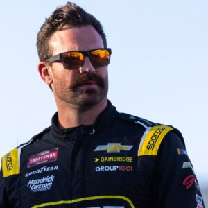 Oct 31, 2025; Avondale, Arizona, USA; NASCAR Truck Series driver Corey LaJoie (77) during the NASCAR Truck Series Championship race at Phoenix Raceway