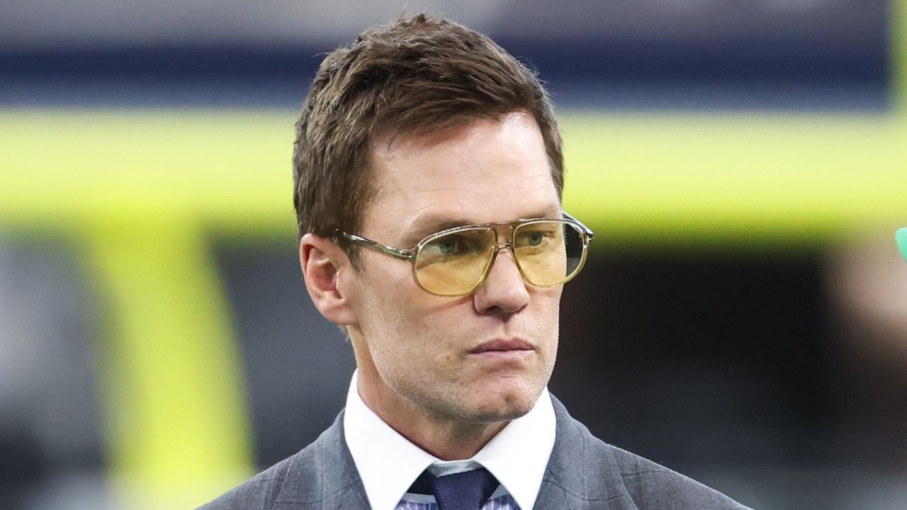 Former NFL quarterback Tom Brady looks on from the sideline before the game between the Philadelphia Eagles and Dallas Cowboys at AT&T Stadium.